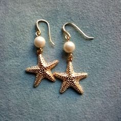 Simple And Yet Special. Pierced Earrings With A Pearl On Top And Gold Starfish Suspended Below. 1 3/4-Inches From Bottom Of Hook To Bottom Of Starfish. New And Never Worn. Gold Starfish Earrings, Beachy Jewellery, Earring Stacks, Beachy Earrings, Starfish Jewelry, Ocean Earrings, Beachy Summer, Beachy Jewelry, Beach Earrings