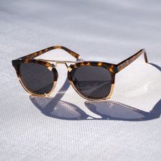 Oversized square Demi demands attention with its eye-catching colors and distinctive design. These stylized horn-rimmed shades feature a gold metal floating double-bridge, offering elevated comfort and effortless style. They come with polarized lenses, 100% UV protection, and sturdy acetate frames, these luxe sunglasses are as practical as they are fashionable. Chic Gold Wayfarer Sunglasses, Trendy Gold Wayfarer Sunglasses, Modern Tortoiseshell Sunglasses For The Beach, Modern Gold Sunglasses For The Beach, Modern Tortoiseshell Sunglasses For Everyday, Trendy Tortoiseshell Sunglasses For Everyday, Gold Anti-reflective Sunglasses For The Beach, Gold Anti-reflective Sunglasses For Beach, Casual Gold Sunglasses For Everyday Use