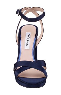 Crisscrossing vamp straps and a lustrous upper create modern allure on an elegant sandal lifted by a wrapped block heel. Adjustable ankle strap with buckle closure Synthetic upper and lining/leather sole Imported Formal Sandals With 4-inch Heel And Cross Strap, Elegant Cross Strap Sandals For Night Out, Cross Strap 4-inch Heels For Evening, Evening Cross Strap Heels With 4-inch Heel, Evening Heels With 4-inch Cross Strap, Evening Heels With 4-inch Heel And Cross Strap, Formal Heels With Heel And Cross Strap, Cross Strap Sandals With Heel Strap For Night Out, Chic Evening Sandals With Cross Strap