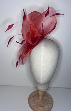 Complete your look with a beautiful crinoline fascinator! This stunning accessory features a 10.5cm diameter sinamay base with coordinating feathers and a headband for a comfortable fit. It's available in a variety of colors to complement any outfit. 🖤Shipped in a sturdy (keepsake) box and packed with special love and care.  🖤Made in the UK - customised fascinator orders are welcome. Please send me a message and we can create something unique.  Terms & Conditions I hope you love your purchase however I gladly accept returns, exchanges and cancellations. Head pieces must be returned within 14 days with all tags attached for a full refund. Cancellation must be made within 2 days of purchase.  🖤Finally I would love to share in your special day so please tag or send me pictures of you looki Luxury Red Fascinator For Formal Occasions, Crinoline Fascinator, Wedding Guess, Red Fascinator, Fascinator Wedding, Fabric Roses, Fascinator Hats, Keepsake Box, Race Day