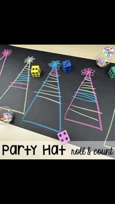 a blackboard with chalk drawings on it and dices in the shape of christmas trees