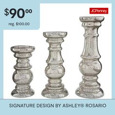 three glass candlesticks are on sale for $ 90