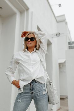 The styling possibilities are endless with the "Good Karma" button-down top! This classic white top features a woven fabric and collared neckline. Styled with the It is the definition of a year round closet staple. Model is in a size small Casual Layering Piece Fall Blouses Lightweight Button Down Patterns May Vary Colors May Vary Everyday White Shirt For Fall, Everyday White Buttoned Shirt, White Shirt For Everyday, White Button-down Shirt For Everyday, White Everyday Fall Shirt, Everyday Fall White Shirt, Versatile White Button-up Blouse, White Blouse With Button Closure For Everyday, Round Closet