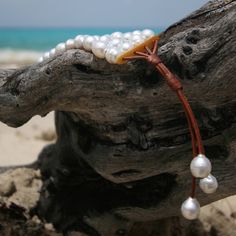 Handmade Adjustable Luxury Pearl Bracelet, Handmade White Leather Jewelry, Adjustable Pearl White Bohemian Jewelry, Adjustable Bohemian Pearl White Jewelry, White Bohemian Leather Jewelry, White Leather Bohemian Jewelry, Bohemian White Leather Jewelry, Elegant Hand Wrapped Leather Jewelry, Pearl Cuff Bracelet