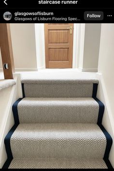 an image of a stair runner on the stairs in a house that is painted white and blue