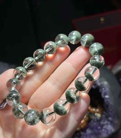 11mm 7A Natural Premium Green Phantom Ghost Garden Quartz Beads Bracelet Gemstone Bracelet Jewellery 全天然精品绿幽灵聚宝盆手链 巴西 晶体干净 盆形好 Size：11mm Grade ： 7A, premium  Other sizes are available upon request.  All of our items are handmade with love, and purified with powerful geode before their journey to you. Orders are ready to ship within 1-3 business days from Hong Kong About Phantom Quartz -------------------------------- A Phantom is a crystal or mineral deposit within a crystal. While the color of Phantoms will vary from crystal to crystal, depending upon the type of mineral of which they are made, Phantoms look like the "ghost" of a crystal within another crystal.  It is a stone for "career" which will help you to get your dream job and be employed easily. Wearing a Green Phantom Quartz brac Phantom Ghost, Garden Quartz, Phantom Quartz, Bracelet Gemstone, Wear Green, Quartz Beads, Gemstone Beaded Bracelets, Quartz Bracelet, Beads Bracelet