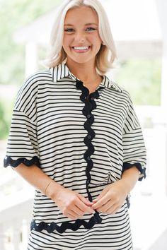 This blouse perfect for summer fun! The print and colors are so classic! We especially love it paired with the rickrack trim! This blouse is going to look great with shorts or jeans. But we think you are going to really love it paired with the... Beach Tops With Striped Collar And Short Sleeves, Summer Vacation Tops With Striped Collar, Summer Short Sleeve Blouse With Striped Collar, White Summer Blouse With Striped Collar, Summer Blouse With Striped Collar, Casual Vacation Top With Striped Collar, Summer Collared Top For Day Out, Button-up Tops With Striped Collar For Day Out, Casual Tops With Striped Collar For Vacation