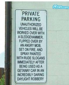 a sign on the side of a building that says private parking unauthorized vehicles will be worked over with a sledge hammer