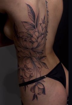 a woman's back with flowers on it