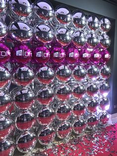 many shiny balls are stacked on top of each other