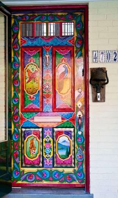 the front door is decorated with colorful designs