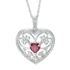 Show the July birthday girl your love with this charming fashion pendant. Crafted in sterling silver, this sparkling design showcases a 5.5mm heart-shaped lab-created bright red ruby center stone surrounded in diamond-accented filigree heart frame. Buffed to a brilliant luster, this keepsake pendant suspends along an 18.0-inch rope chain that secures with a spring-ring clasp. Heart Shaped Diamond Pendant, July Birthday, Fashion Pendant, Peoples Jewellers, Stylish Necklace, Heart Frame, Casting Jewelry, Heart Shaped Diamond, Red Ruby