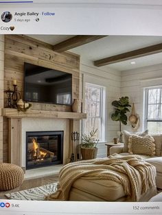 a living room with a fire place and tv above the fireplace in front of it