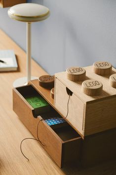 a desk with a wooden box and some sort of electronic device on top of it