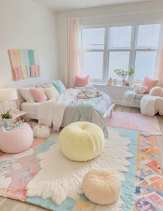 a bedroom with pastel colors and rugs on the floor