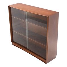 a wooden cabinet with glass doors on the front and bottom shelves in two different colors