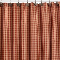 a red and white checkered curtain with stars on it