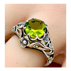 Vintage 1.50 Carat Simulated Peridot "SCOTTISH THISTLE" In 925 Solid Sterling Silver Solitaire Filigree Ring. Intricate Floral Details. The Top Of The Ring Measures 1/2 Inch In Length. Stamped 925.  Excellent Condition/Like New  Ring Sizes 5-12. Classic Green Filigree Ring As Gift, Classic Green Emerald Ring Stamped 925, Classic Green Filigree Round Ring, Antique Green Filigree Ring For Anniversary, Ornate Green Rings For Anniversary, Green Emerald Filigree Ring For Anniversary, Green Filigree Ring For Anniversary, Ornate Green Rings As Gift, Heirloom Style Green Filigree Ring As Gift