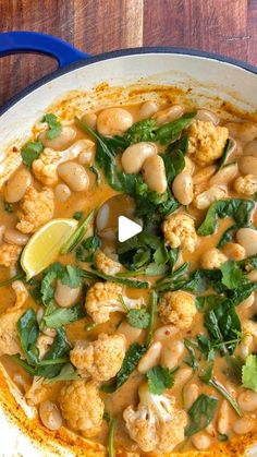 cauliflower and chickpeas with spinach in a white sauce