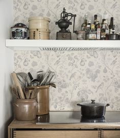 pots and pans are sitting on top of the kitchen counter next to each other