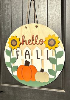 a wooden sign that says hello fall with pumpkins and sunflowers on it