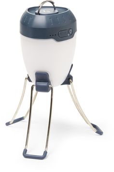 an egg cooker is sitting on a stand with the lid open and it's legs extended