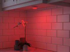 a red light illuminates the corner of a room with two vases and a flower