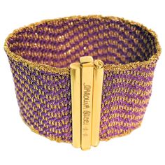 From designer Carolina Bucci, her design style really shows in this beautiful bracelet. This has never been worn, and you can't find it any more! 18 karat yellow gold woven with purple silk strands in a wavy chevron pattern. Bracelet has a concealed closer with "Caroline Bucci" stamped as well as her signature bees. Approximately 6.5 inches long and over 1.5 inches wide. Original tag attached. Chevron Pattern Bracelet, Gold Woven Bracelet, Carolina Bucci, Pattern Bracelet, Woven Bracelet, Woven Bracelets, Purple Silk, Crown Jewels, Fabulous Jewelry