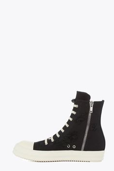 Rick Owens DRKSHDW High Top Slashed Ramones Sneakers Designer's ID: DU01B7800-SBSLH Rick Owens DRKSHDW High Top Slashed Ramones Sneakers! These stylish sneakers are sure to turn heads wherever you go. They're made with high-quality materials and construction, and feature eight eyelets, laces, a zipper on the inside ankle for easy fastening, toe caps, and shark-tooth soles. Color: Black Composition: 100% Canvas Made in ITALY Rick Owens Drkshdw, Money On My Mind, Ramones, Shark Teeth, Stylish Sneakers, Rick Owens, Golden Goose Sneaker, Converse High Top Sneaker, Converse Chuck Taylor High Top Sneaker