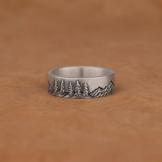 Mountains and Pine Trees Forest Art Ring Silver Ring,  Minimalist 925 Sterling Silver Oxidized Engagement Ring, Nature Inspired Jewelry Gifts ✅ Handcrafted with love and joy, this ring will be with you for years to come, possibly even taking its place as a family heirloom for generations to come!  ✅ With its detailed handmade engravings, this silver ring will catch some serious attention and make a beautiful gift for your beloved ones. ✅ It's very elegant and classy for everyday use but also can Nature-inspired Sterling Silver Ring Stamped 925, Nature-inspired Sterling Silver Ring, Etched Sterling Silver Open Ring, Minimalist Sterling Silver Engraved Ring, Nickel Free, Etched Sterling Silver Open Ring Jewelry, Minimalist Sterling Silver Engraved Ring Nickel Free, Minimalist Nickel-free Sterling Silver Engraved Ring, Minimalist Nickel-free Engraved Ring, Sterling Silver Etched Jewelry For Promise