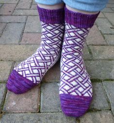 the legs of a person wearing purple socks