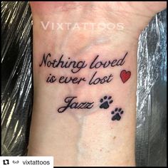 a wrist tattoo with the words nothing loved is ever lost and a dog's paw