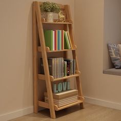 a wooden book shelf with books on it