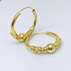 Yellow gold plated extra large hoop earrings.  These extra large wire hoop earrings are handmade from high quality sterling silver. Sold as a pair or as a single earring.Base metal:  solid high quality 925 sterling silverOuter plating:  yellow goldInner diameter: 16mmOuter diameter: 20mmEar Post: 20 gauge, normalMeasurements are an approximation.Thank you for your interest in our large wire hoop earrings. Classic Handmade Gold Huggie Earrings, Handmade Brass Hoop Huggie Earrings, Handmade 14k Gold Hoop Earrings, Yellow Gold Hoop Earrings With Ear Wire, Hypoallergenic Small Hoop Gold Plug Earrings, Hallmarked Hoop Metal Jewelry, 14k Gold Hoop Cartilage Earrings With Ear Wire, Gold-plated Hoop Cartilage Earrings, Handmade Classic Gold Hoop Earrings