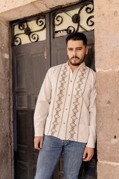 This beautiful Traditional Guayabera for Men has an ethnic embroidered design and adds a modern and sophisticated flare to your wardrobe.  It is made out of fine Mexican cotton and is completely embroidered by artisanal Machine- hand manipulated. This elegant long sleeve button up Shirt is perfect for special occasions such as Mexican Fiestas, Quinceañeras, Weddings, etc. This guayabera is made by Mexican Artisans in Chiapas, Mexico. Cotton Long Sleeve Bandhgala For Traditional Ceremonies, Cotton Bandhgala For Traditional Ceremonies, Long Sleeve Cotton Bandhgala For Traditional Ceremonies, Traditional Wedding Wear With Woven Motifs And Long Sleeves, Traditional Long Sleeve Wedding Wear With Woven Motifs, Traditional Long Sleeve Wedding Shirt, Traditional Wedding Wear With Geometric Embroidery, Traditional Long Sleeve Shirt, Traditional Long Sleeve Shirt With Patterns