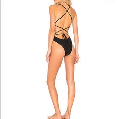 This Bathing Suit Is Like A Spandex Bathing Suit. Sucks You In In All The Right Places! High Cut Legs, Skimpy Bottom, Lace Up Back That Is Adjustable. The Material Is A Nice Thick, Black Rib. I Have This Swimsuit And It’s One Of My Favorites! So Flattering On And I Also Wear As A Bodysuit. Nwt And Ships From A Smoke Free And Pet Free Home. No Trades Please, Just Looking To Sell. Thanks! Black Strappy Beachwear Bodysuit, Black Strappy Bodysuit For Beachwear, Fitted Strappy Bodysuit For Poolside, Strappy Black Bodysuit With Lined Body, Black Strappy Lined Bodysuit, Black Stretch Strappy Bodysuit, Lace Bathing Suit, Cheeky One Piece Swimsuit, High Leg Swimsuit