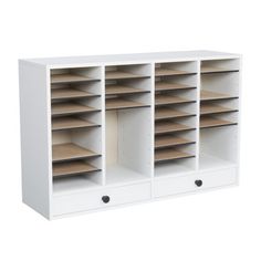 a white bookcase with several shelves and two drawers on each side, one is open