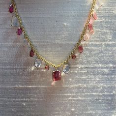 "Featuring 9 carats of  natural and earthmined tourmaline , and 10 carats of natural pink kunzite. The gems are set in a multi shape design, alternating in bezel settings dangling from a 14K yellow gold rolo chain. The gems span 7.5\" long, and the necklace is 16\" around. The heart is .75x.50\" , weighing 9 carats in total A one of a kind piece Marked 14K 10.2g" Luxury Multi-stone Pink Gemstones, Luxury Pink Multi-stone Gemstones, Gold Multi-stone Pink Sapphire Jewelry, Gold Jewelry With Multi-stone Pink Sapphire, Gold Multi-stone Jewelry With Pink Sapphire, Pink Sapphire Multi-stone Gold Jewelry, Luxury Tourmaline Gemstone Jewelry, Fine Jewelry With Multi-stone Pink Sapphire, Pink Sapphire Multi-stone Jewelry For Gifts