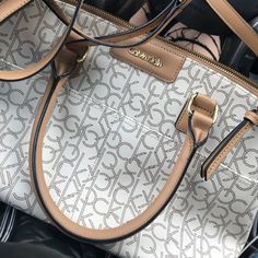 Brand New Calvin Klein Bag - Never Even Used! Nothing Wrong With It, Just Have Bags That Are Already Very Similar. Originally $148 Http://Www.Calvinklein.Us/En/Womens-Clothing/Womens-Handbags/Hudson-Monogram-Satchel-36193221 Elegant Calvin Klein Shoulder Bag, Chic Calvin Klein Shoulder Bag With Top Carry Handle, Calvin Klein Office Tote Bag, Elegant Calvin Klein Bags For Office, Classic Calvin Klein Office Bag, Elegant Calvin Klein Office Bag, Calvin Klein Shopping Bag With Branded Hardware, Chic Calvin Klein Bags With Branded Hardware, Elegant Calvin Klein Shoulder Bag With Detachable Handle