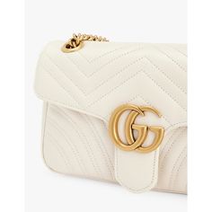 Find GUCCI Marmont Quilted Leather Shoulder Bag on Editorialist. This Gucci shoulder bag is crafted from quilted leather and features a clasp fastening, adjustable strap, front flap, brand plaque at the front, one main compartment, interior zipped pocket, and a lined interior. It measures 13cm in height, 21.5cm in width, and 6.5cm in depth. The bag can be worn on the shoulder or crossbody and comes with a dust bag. Gucci Marmont, Gucci Shoulder Bag, Leather Cleaning, In Depth, Quilted Leather, Clothing Ideas, Leather Shoulder Bag, Adjustable Straps, Dust Bag