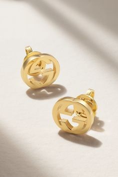 Gucci's earrings are cast from 18-karat gold in the shape of the house's renowned 'Interlocking G' logo. Wear yours day or night. Classic Gucci Earrings For Anniversary, Gucci White Gold Round Earrings, Gucci Sterling Silver Earrings For Formal Occasions, Gucci Luxury Sterling Silver Earrings, Gucci White Gold Sterling Silver Earrings, Luxury Gucci Sterling Silver Earrings, 14k Gold Earrings For Everyday Luxury, Gucci Sterling Silver Earrings As Gift, Gucci Sterling Silver Earrings For Gift