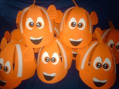 an assortment of orange clown fish sitting on top of each other