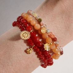 You are rooted in strength, and ready to begin anew. A gemstone bracelet of carnelian—stone of confidence and strength—empowers its wearer while delicate golden lotus petals inspire new beginnings. Wear this stretch bracelet alone, or stack it with other healing gemstone bracelets for a truly personalized look. Lotus - new beginnings, infinite potential Carnelian - protection, stability, calm Multi Carnelian 4mm faceted round Bracelet length: 7" Pendant size: 8 x 6mm 18k Gold plated Brass Golden Mandala, Satya Jewelry, Golden Lotus, Round Bracelet, Pave Bracelet, Healing Gemstone Bracelets, Carnelian Bracelet, Red Carnelian, Aventurine Stone