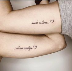 two people with matching tattoos on their arms, one has the words and the other says