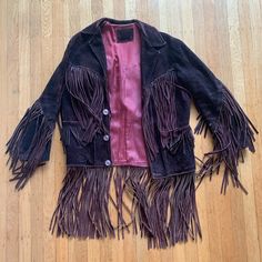 Gorgeous Vintage Jacket In A Dark Brown With Burgundy Undertones. Vintage Condition (Years Of Love But Good Shape). Has One Or Two Shorter Fringe Strands On The Left Arm And I Missing Very Top Button (Though It Really Isn’t Necessary). Such A Fun Piece. Dark Brown With Burgundy, Brown Tassel Jacket, Vintage Leather Jacket With Fringe For Winter, Brown Leather Jacket With Fringe, Leather Fringe Coats & Jackets, Vintage Brown Fringed Outerwear, Brown Suede Jacket, Short Fringe, Suede Jacket