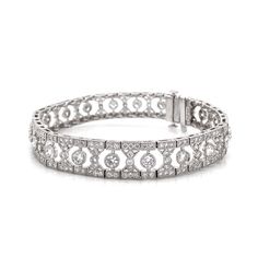 Slim vintage and Art Deco inspired diamond platinum bracelet. Adorned with white round cut diamonds in 6.12 carat total. Diamonds are all natural in G-H Color Clarity VS. Platinum 950 bracelet. Length: 17.5 cm Width. 1 cm Weight: 28.9 g [shortcode] [video] [/video] [/shortcode] Exquisite Platinum Diamond Bracelet With Brilliant Cut, Exquisite Platinum Tennis Bracelet With Diamond Accents, Exquisite Platinum Diamond Cut Bracelet, Exquisite Diamond Cut Platinum Bracelet, Exquisite Platinum Diamond Bracelet With Single Cut Diamonds, Luxury Platinum Diamond Bracelet With Single Cut Diamonds, Platinum Diamond Bracelet With Pave Setting, Art Deco Diamond Tennis Bracelet With Brilliant Cut, Luxury Round Platinum Diamond Bracelet