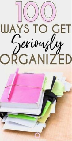 a pile of notebooks with the words, 100 ways to get seriously organized