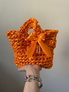 Crochet bag handmade, satin ribbon. 🧡 Width: 22cm Length: 17cm -Accessories and a little bag inside are included! ENG: Handmade wallet, Crochet, with Razo ribbon. 🧡 Accessories and a small bag inside are included. Measurements: Width: 22cm, Length: 17cm Cinta Crochet Bag, Ribbon Yarn Crochet Bag, Trendy Yellow Handmade Crochet Bag, Satin Ribbon Crochet Bag, Crochet Bow Purse