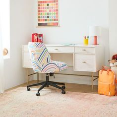 a child's room with a desk and chair