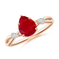 an oval shaped ruby and diamond ring with two white diamonds on the band, set in 18k rose gold